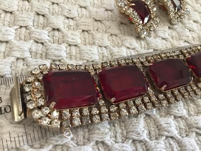 Found similar on eBay and Etsy stating it is. Please do your research Gorgeous DE Juliana Red Clear Rhinestone Set