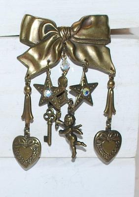 HEARTS, STARS, CHERUB & KEY Dangles on a BOWTIE RIBBON Style BROOCH (3" x 2") on a Dark "Brass" Setting