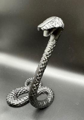 Black Metal Snake Ready to Strike