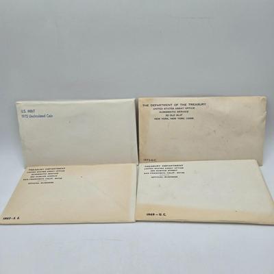 LOT 122: U.S. Mint Uncirculated Coin Sets from 1965, 1969, 1972, 1975