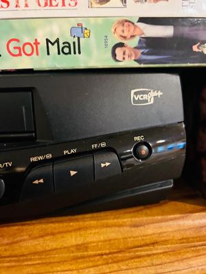 QUASER 4 HEAD VCR AND A GREAT ASSORTMENT OF VHS MOVIES