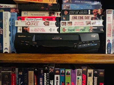 QUASER 4 HEAD VCR AND A GREAT ASSORTMENT OF VHS MOVIES