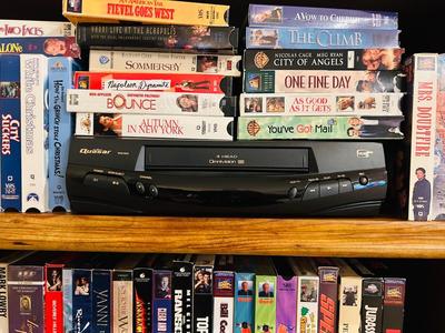 QUASER 4 HEAD VCR AND A GREAT ASSORTMENT OF VHS MOVIES
