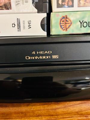 QUASER 4 HEAD VCR AND A GREAT ASSORTMENT OF VHS MOVIES