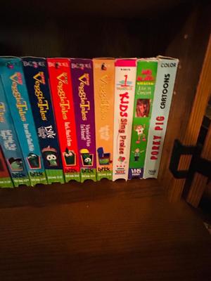 SEVERAL DISNEY MOVIES AND OTHER GREAT FAMILY MOVIES IN A NICE STORAGE CABINET