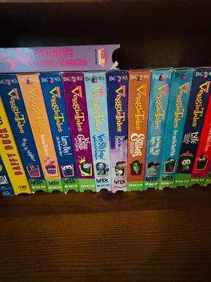 SEVERAL DISNEY MOVIES AND OTHER GREAT FAMILY MOVIES IN A NICE STORAGE CABINET