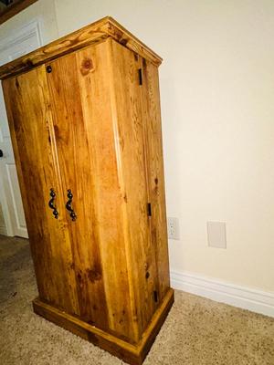 SEVERAL DISNEY MOVIES AND OTHER GREAT FAMILY MOVIES IN A NICE STORAGE CABINET