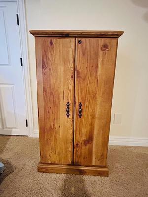 SEVERAL DISNEY MOVIES AND OTHER GREAT FAMILY MOVIES IN A NICE STORAGE CABINET