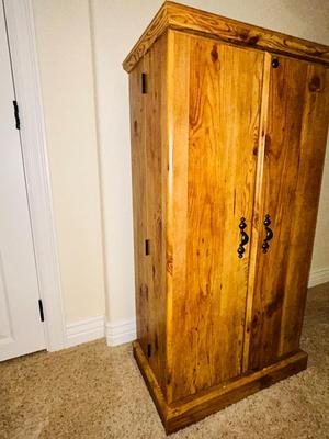 SEVERAL DISNEY MOVIES AND OTHER GREAT FAMILY MOVIES IN A NICE STORAGE CABINET