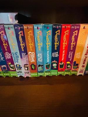 SEVERAL DISNEY MOVIES AND OTHER GREAT FAMILY MOVIES IN A NICE STORAGE CABINET