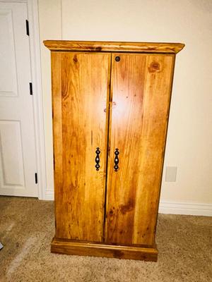 SEVERAL DISNEY MOVIES AND OTHER GREAT FAMILY MOVIES IN A NICE STORAGE CABINET