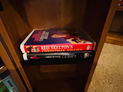 SEVERAL DISNEY MOVIES AND OTHER GREAT FAMILY MOVIES IN A NICE STORAGE CABINET
