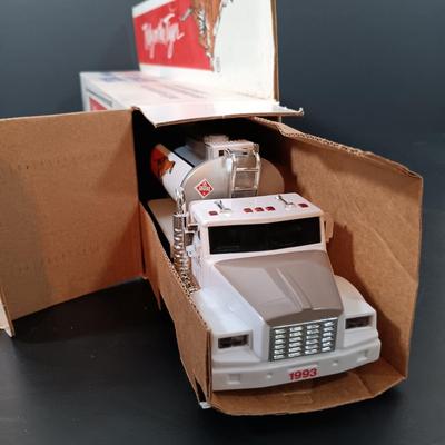 LOT 24: Miniature Hess Trucks, Texaco Havoline Racing Die-cast 1994 Bank, Mobil Collectible Toy Truck & More