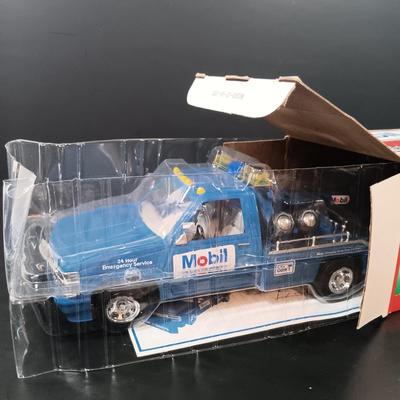 LOT 24: Miniature Hess Trucks, Texaco Havoline Racing Die-cast 1994 Bank, Mobil Collectible Toy Truck & More