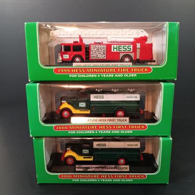 LOT 24: Miniature Hess Trucks, Texaco Havoline Racing Die-cast 1994 Bank, Mobil Collectible Toy Truck & More