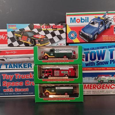 LOT 24: Miniature Hess Trucks, Texaco Havoline Racing Die-cast 1994 Bank, Mobil Collectible Toy Truck & More
