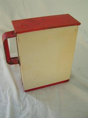 Metal canister w/sliding metal lid, folded metal handle. Likely c.1950s.