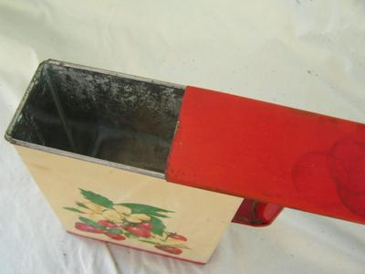 Metal canister w/sliding metal lid, folded metal handle. Likely c.1950s.