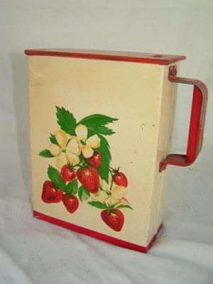 Metal canister w/sliding metal lid, folded metal handle. Likely c.1950s.