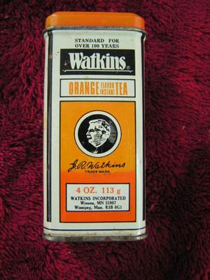 Group of Watkins spice tins and bottles.