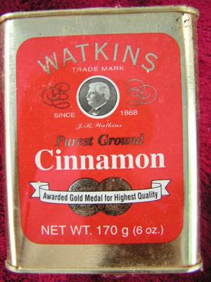 Group of Watkins spice tins and bottles.