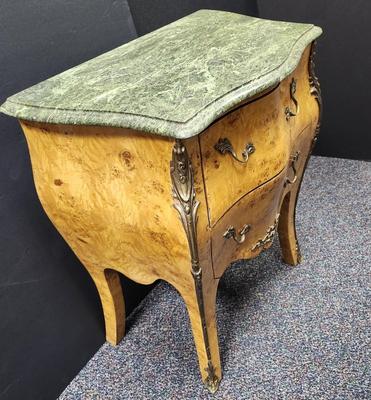 Sale Photo Thumbnail #342: Beautiful Burl wood and Ormolu Bombe commode nightstand chest.  Two drawers .  The marble top is not attached, it just sits atop the table.  This piece is in very nice condition.  Retail prices range from $550 to $1200.  
29.5 inches tall, 23.5 inches wid