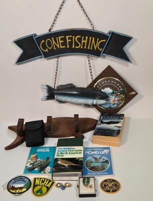 LOT 99L: Boy Scout Patches, Bird Books, Binoculars, Wooden Fish Shaped Rod Holder, Gone Fishing Sign, Sportsman Thermometer, Flyboys by...