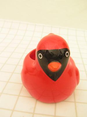 Small ceramic window sill planter in likeness of a cardinal bird.