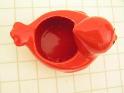 Small ceramic window sill planter in likeness of a cardinal bird.