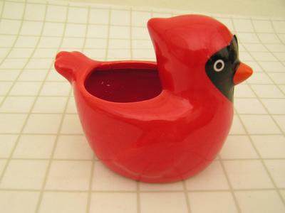Small ceramic window sill planter in likeness of a cardinal bird.