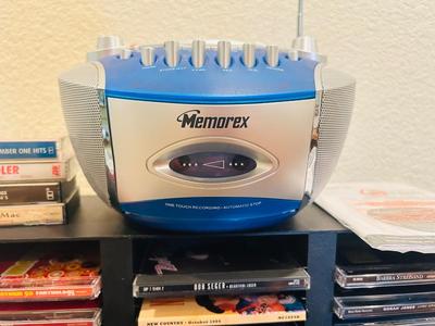 MEMOREX PORTABLE CD PLAYER WITH AM/FM STEREO AND CASSETTE PLAYER ALONG WITH SOME CD’s & CASSETTE