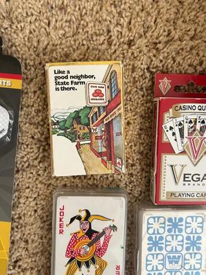 VINTAGE POKER CHIPS, DECKS OF CARDS AND A BUNCH OF DARTS
