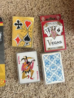 VINTAGE POKER CHIPS, DECKS OF CARDS AND A BUNCH OF DARTS
