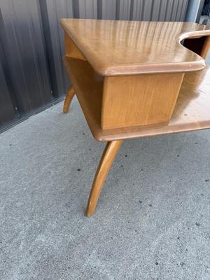 Sale Photo Thumbnail #29: Z3-Heywood Wakefield Corner Table

There is no makers mark on the bottom of this corner table.
Please see photos for damage, this piece will require some TLC.