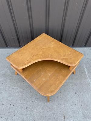 Sale Photo Thumbnail #26: Z3-Heywood Wakefield Corner Table

There is no makers mark on the bottom of this corner table.
Please see photos for damage, this piece will require some TLC.