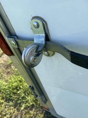 Sale Photo Thumbnail #48: Z4-Enclosed Trailer with hitch lock and padlock for door