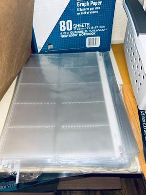 AN ARRAY OF DIFFERENT PAPER AND, LABELS SLEEVES, HOLE PUNCH AND OTHER ITEMS