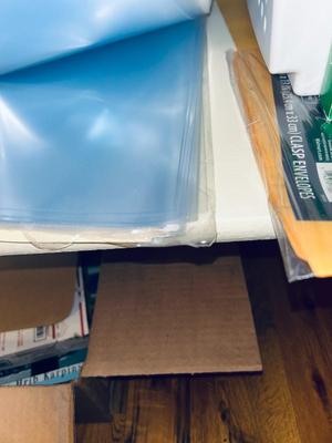 AN ARRAY OF DIFFERENT PAPER AND, LABELS SLEEVES, HOLE PUNCH AND OTHER ITEMS