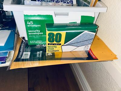 AN ARRAY OF DIFFERENT PAPER AND, LABELS SLEEVES, HOLE PUNCH AND OTHER ITEMS