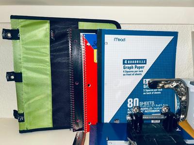 AN ARRAY OF DIFFERENT PAPER AND, LABELS SLEEVES, HOLE PUNCH AND OTHER ITEMS