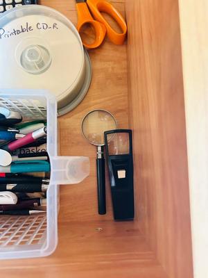 DESK DRAWER PACKED WITH DIFFERENT OFFICE SUPPLIES