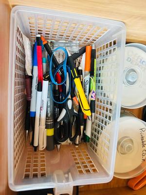 DESK DRAWER PACKED WITH DIFFERENT OFFICE SUPPLIES