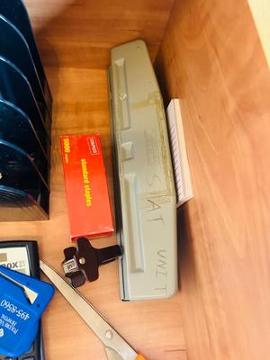 DESK DRAWER PACKED WITH DIFFERENT OFFICE SUPPLIES