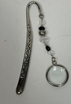 Purse Keeper with attached magnifying glass