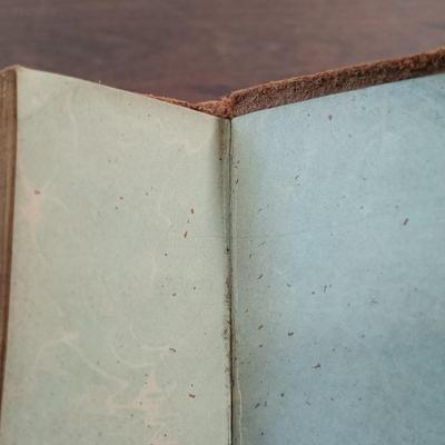 LOT 7: Set of (5) Early 20th Century Leather Bound Miniature 2" Books, Six Volumes of the 1904 Master Pieces of Humor & More