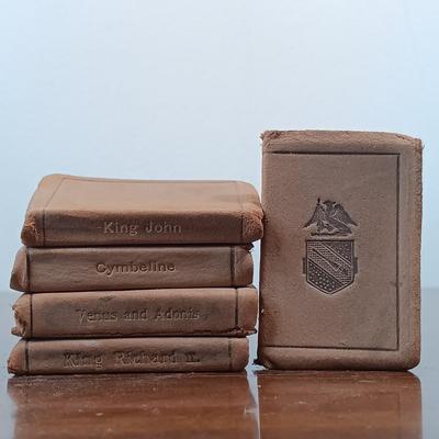 LOT 7: Set of (5) Early 20th Century Leather Bound Miniature 2" Books, Six Volumes of the 1904 Master Pieces of Humor & More