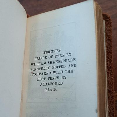 LOT 7: Set of (5) Early 20th Century Leather Bound Miniature 2" Books, Six Volumes of the 1904 Master Pieces of Humor & More