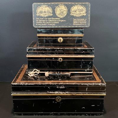 LOT 114: Antique Metal Cash Boxes with Gift of the Colonies Chocolate Tin