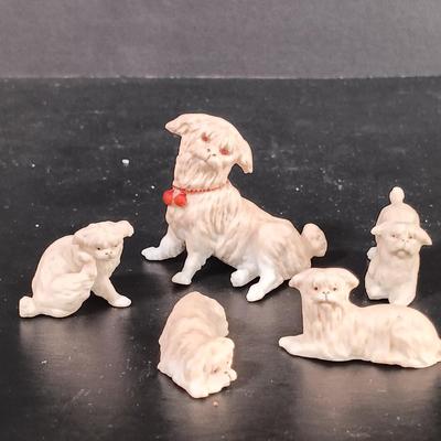 LOT 120: Milk Glass Eggs, Eye Wash Cups, Miniature Bisque Dogs, Porcelain Cigarette Holder Boots & More