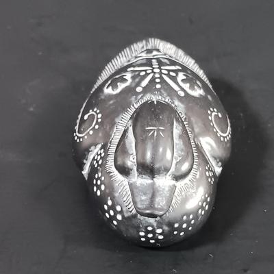 LOT 121: Hand Carved Pearlite Stonecraft Duck, Hexagonal Metal Coin Bank, Carved Stone Game Token & More